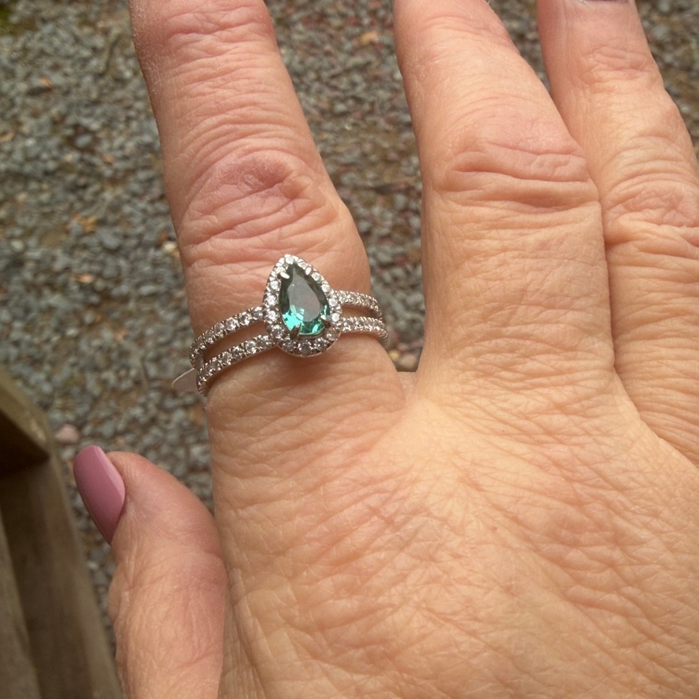 Beautiful Dark Aquamarine ring surrounded by ice crystals